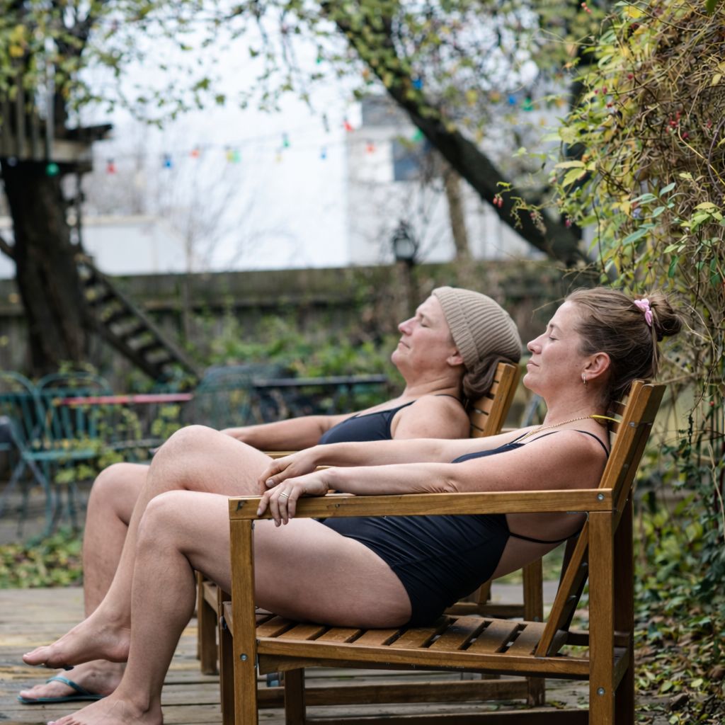 People relaxing outside after sauna